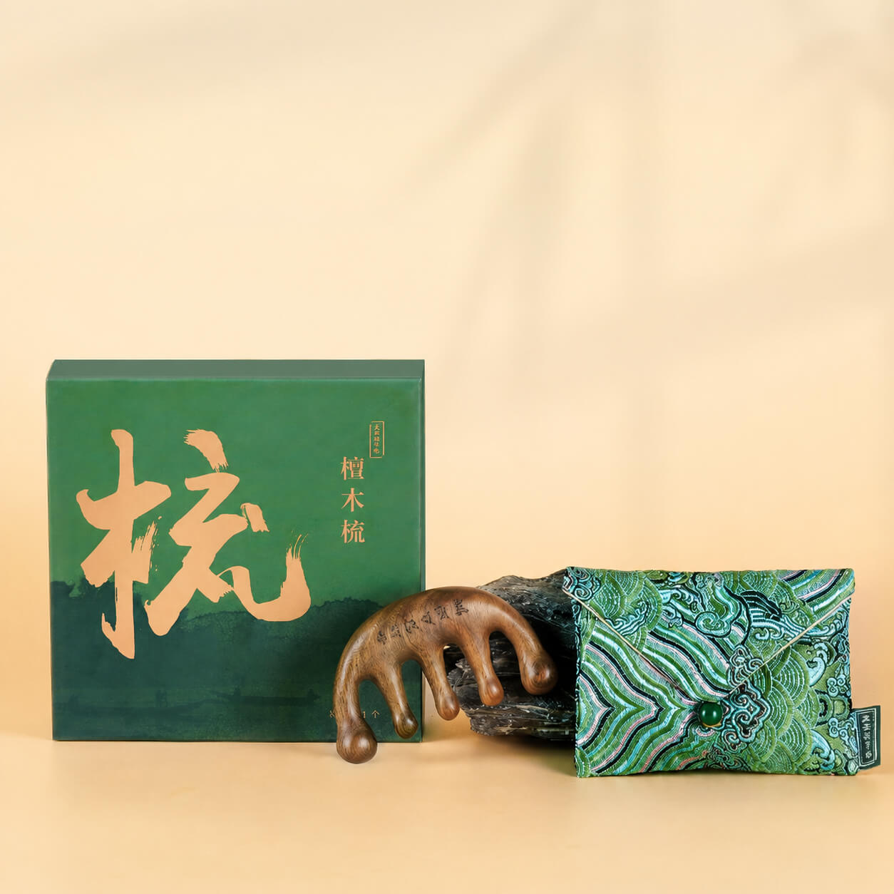 Sandalwood massage comb with traditional Chinese packaging and patterned pouch, presented as a handcrafted scalp massage and relaxation tool on a warm beige background.