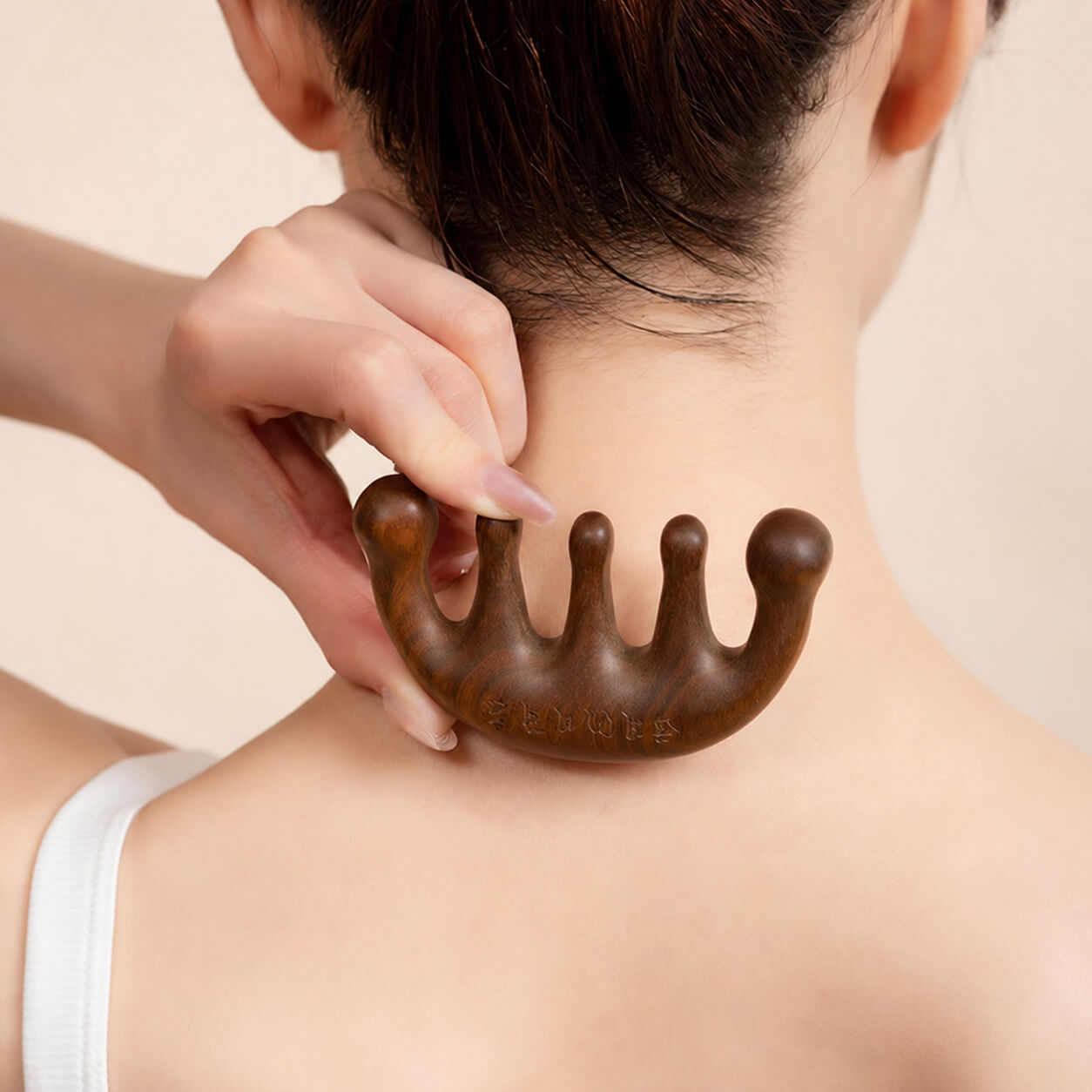 Sandalwood massage comb with traditional Chinese packaging and patterned pouch, presented as a handcrafted scalp massage and relaxation tool on a warm beige background.